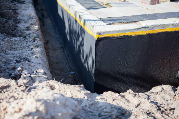 Professional Waterproofing technician working in Salem, OR
